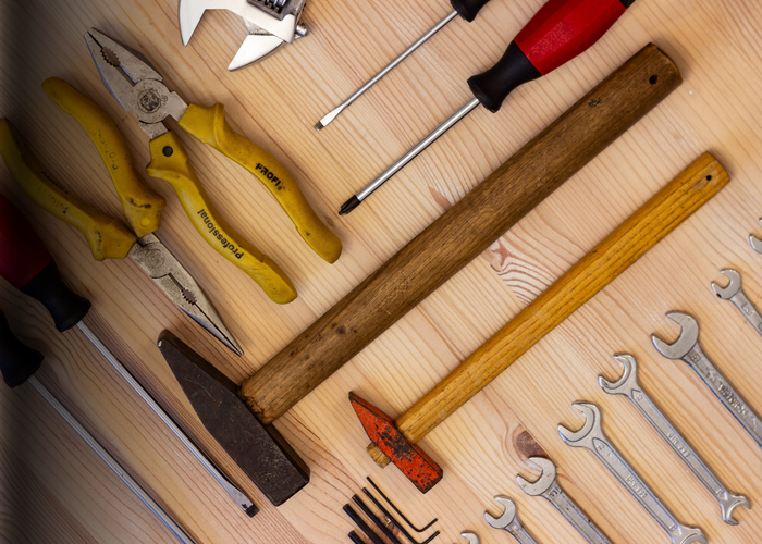 Tools displayed neatly on a wooden table